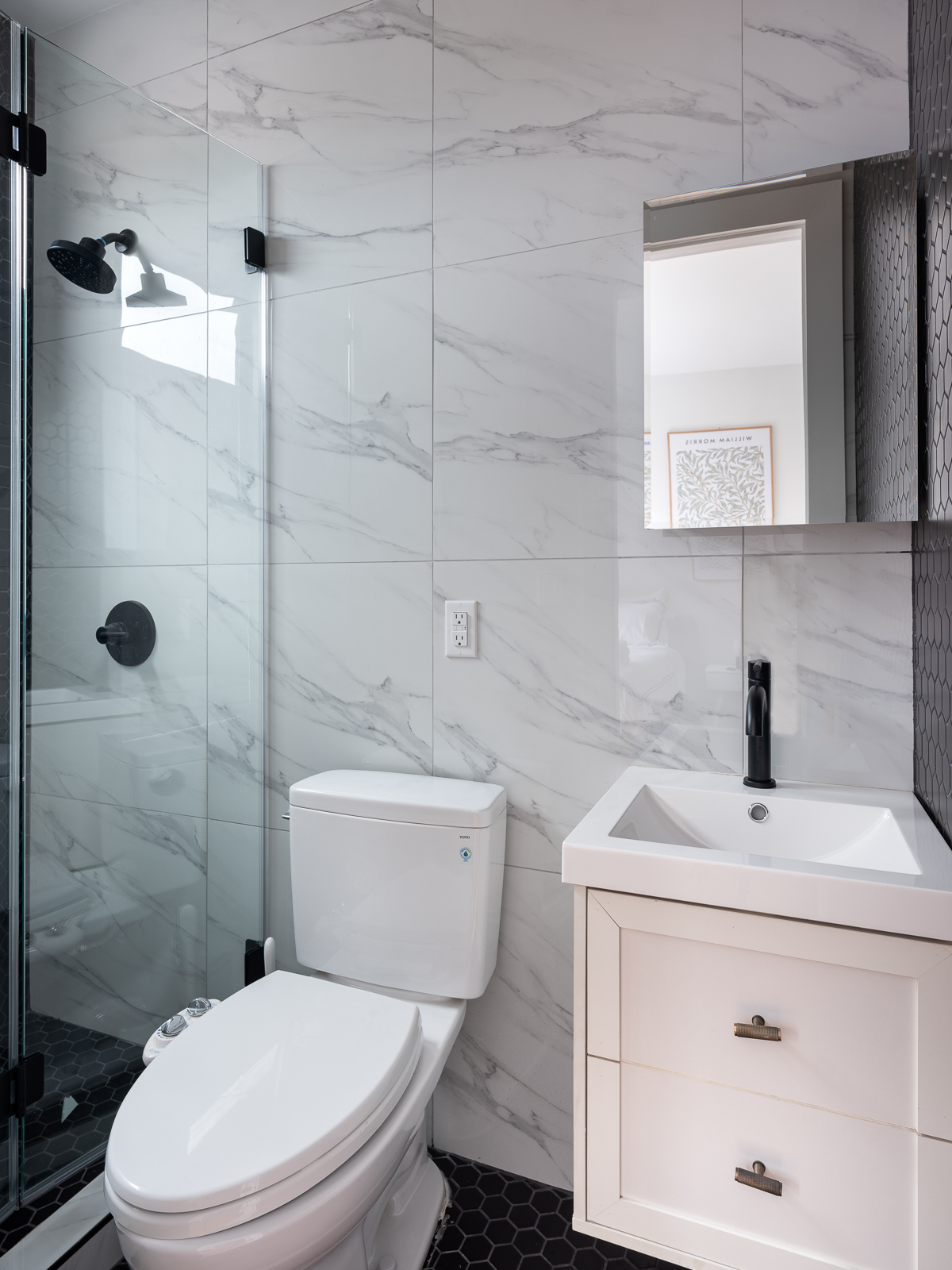 Marble en-suite bathroom with glass shower